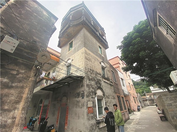 A restored diaolou, a multistory watchtower-style residential building, in the city. [Photo provided to China Daily]